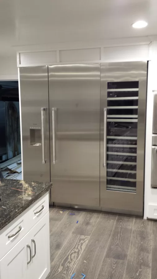 3 column Thermador refrigerator finished with door reversed to open a certain way per cust